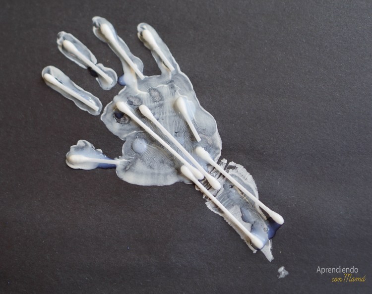 hand print with q-tips to show bones and skeleton